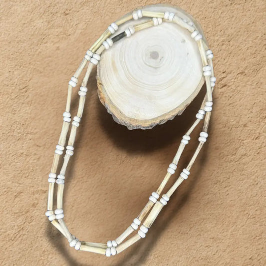 Beaded Tulsi necklace on a wooden surface
