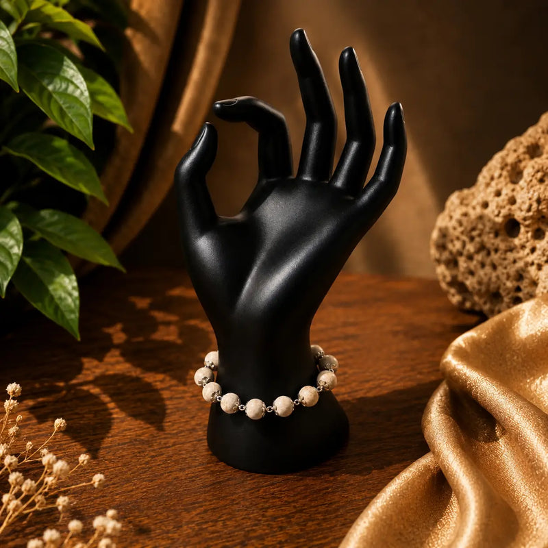 Silver Plated Tulsi  & Bracelet Beads, 10 mm, placed around a black hand mannequin
